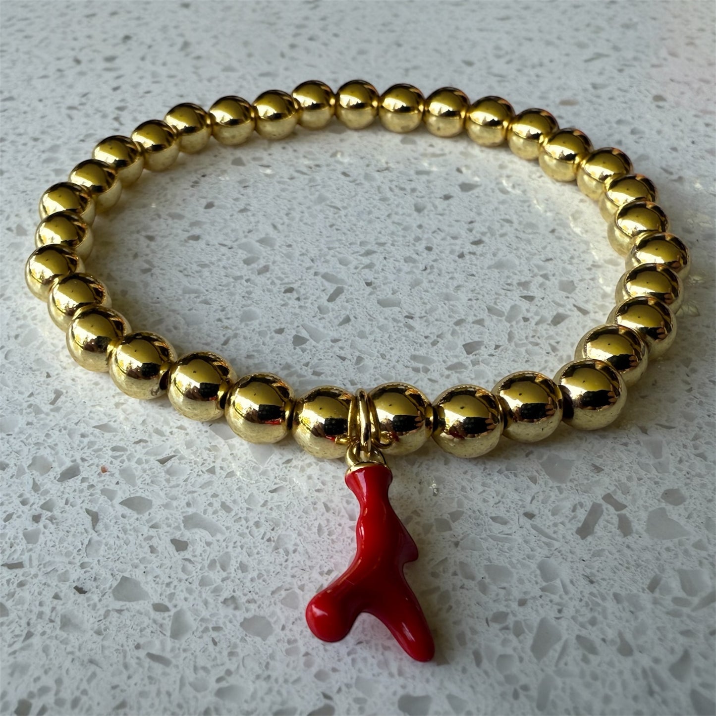 Pulsera de borlas doradas Coral Rojo