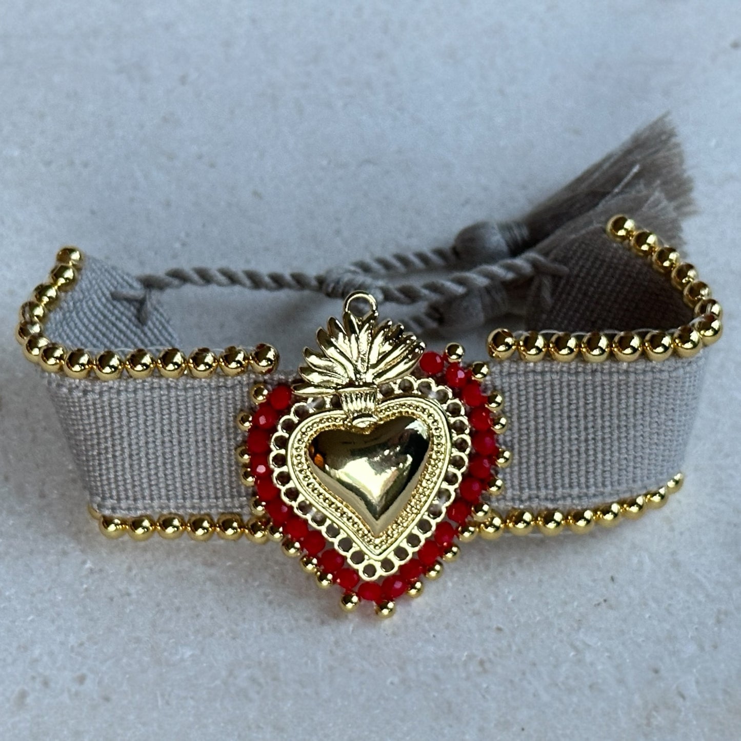 Pulsera corazón borlitas crudo/negro/azul/naranjo/rojo