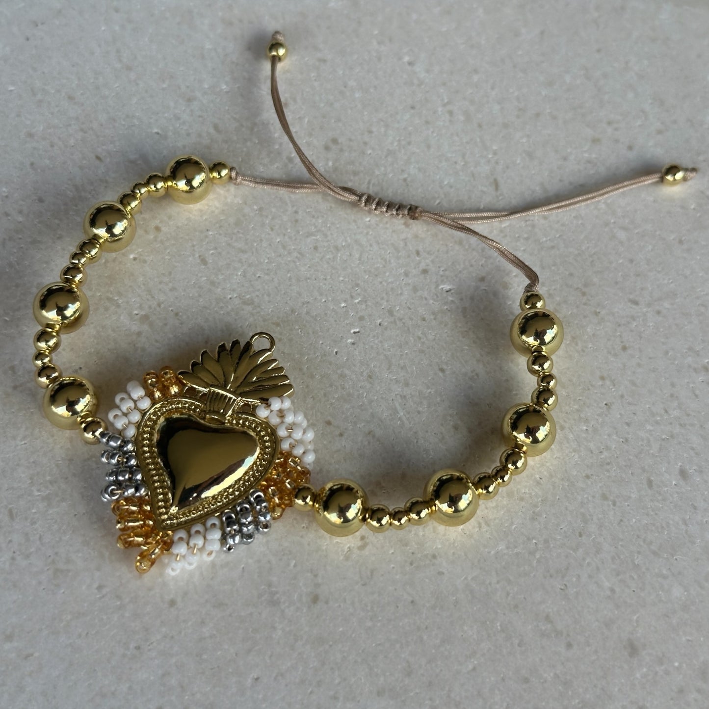 Pulsera corazón detente borlas/borlitas ajustable