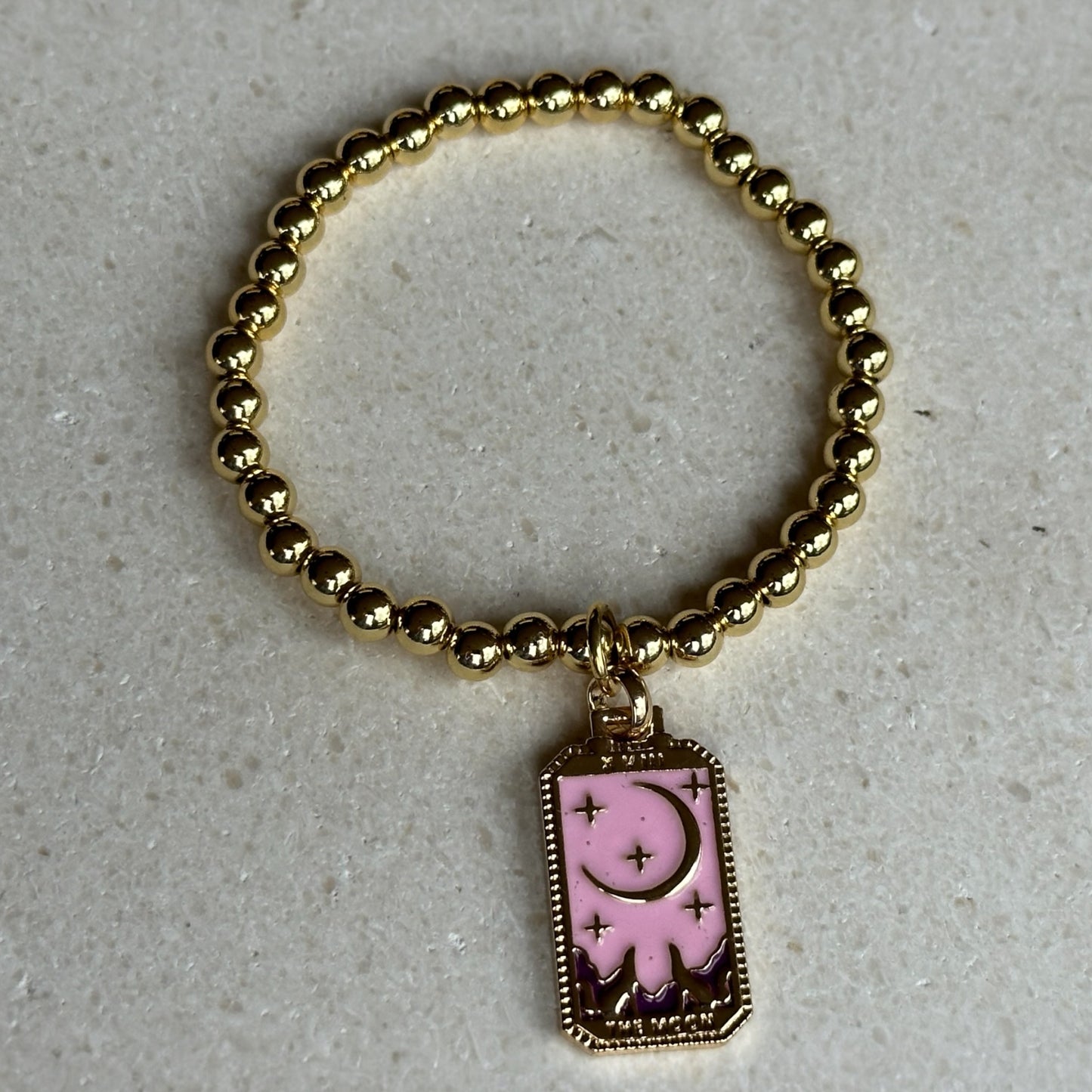 Borlas con dije rosado/media luna y estrellas